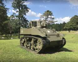 There is Stuart Tank and WW2 artillery piece in the cemetery.